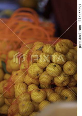 Mandarins in a red net Mandarins in a red net 116436295
