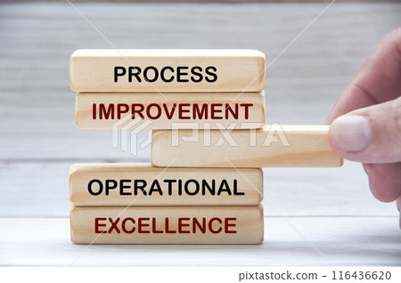 Process improvement and operational excellence text on wooden blocks. Operational excellence concept Process improvement and operational excellence text on wooden blocks. Operational excellence concept 116436620