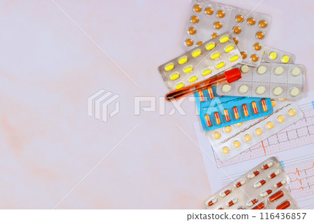 After examining electrocardiogram, cardiologist prescribe necessary medication for treatment of heart diseases After examining electrocardiogram, cardiologist prescribe necessary medication for treatment of heart diseases 116436857