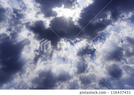 Blue sky where the sun shines through the clouds Blue sky where the sun shines through the clouds 116437431