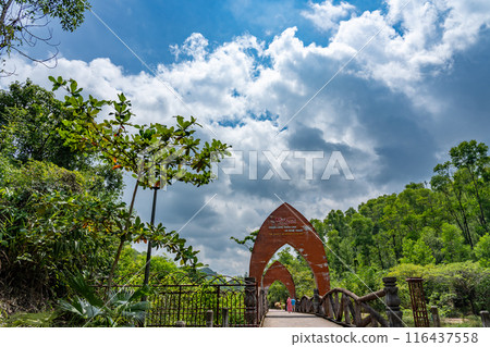My Son ruins, a sacred place of the Champa Kingdom in Vietnam, dedicated to Hindu gods. A bridge and gate just after entering the entrance gate. My Son ruins, a sacred place of the Champa Kingdom in Vietnam, dedicated to Hindu gods. A bridge and gate just after entering the entrance gate. 116437558