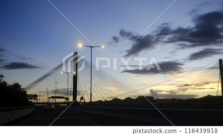 Silhouette of transportation bridge with cars, road at sunset of transportation bridge with cars, road at sunset 116439918