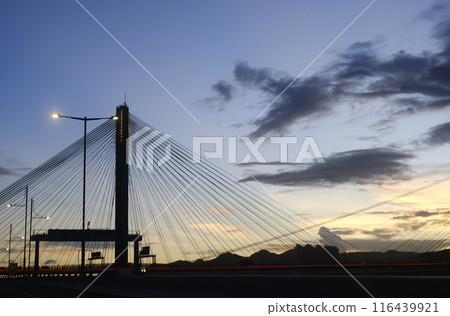 Silhouette of transportation bridge with cars, road at sunset of transportation bridge with cars, road at sunset 116439921
