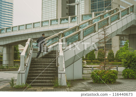 Middle-aged office worker doing outside sales Middle-aged office worker doing outside sales 116440673
