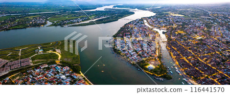 Aerial view of Hoi An Ancient Town with lantern boats on Hoai river, in Hoi An, Vietnam 116441570