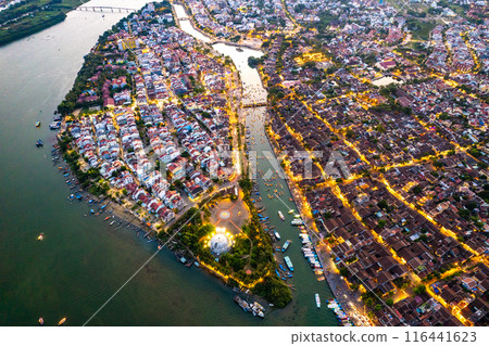 Aerial view of Hoi An Ancient Town with lantern boats on Hoai river, in Hoi An, Vietnam 116441623