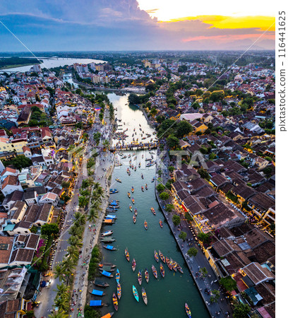 Aerial view of Hoi An Ancient Town with lantern boats on Hoai river, in Hoi An, Vietnam 116441625