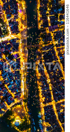 Aerial view of Hoi An Ancient Town with lantern boats on Hoai river, in Hoi An, Vietnam 116441646
