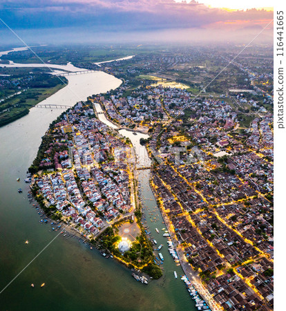Aerial view of Hoi An Ancient Town with lantern boats on Hoai river, in Hoi An, Vietnam 116441665