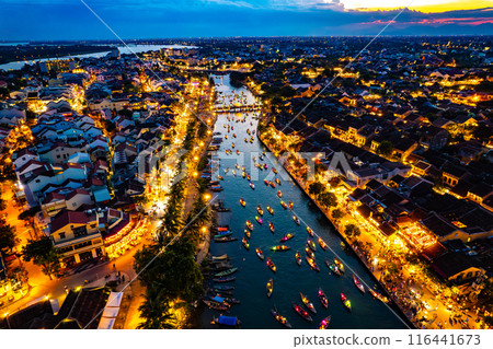 Aerial view of Hoi An Ancient Town with lantern boats on Hoai river, in Hoi An, Vietnam 116441673