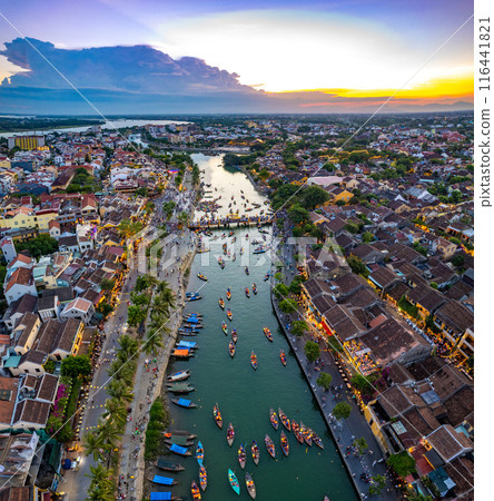 Aerial view of Hoi An Ancient Town with lantern boats on Hoai river, in Hoi An, Vietnam Aerial view of Hoi An Ancient Town with lantern boats on Hoai river, in Hoi An, Vietnam 116441821