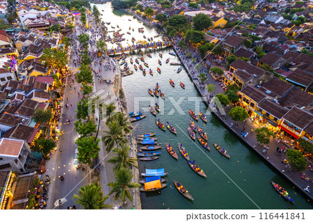 Aerial view of Hoi An Ancient Town with lantern boats on Hoai river, in Hoi An, Vietnam 116441841