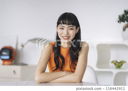 A young woman smiling looking at the camera A young woman smiling looking at the camera 116442911
