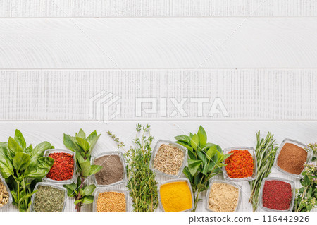 Various herbs and spices on the table 116442926