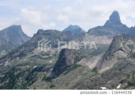 View from the mountain pass to highest rocky peaks of Ergaki National Park. Siberia, Krasnoyarsk region, Russia.  116444336