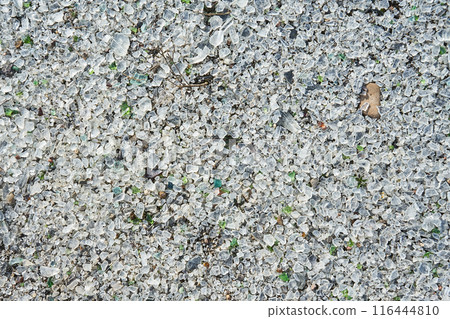 Many small pieces of broken shattered glass of different colors. Many small pieces of broken shattered glass of different colors. 116444810
