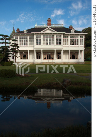 A composition of a white Western-style building reflected on the water surface A composition of a white Western-style building reflected on the water surface 116446133