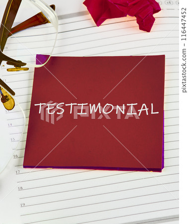 Concept Testimonial word on a red sticker on the background of a sheet in a ruler 116447452