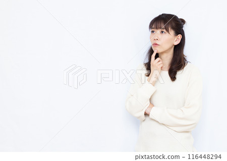 A woman who is seriously worried A woman who is seriously worried 116448294