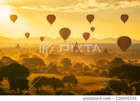 Balloon over plain of Bagan in misty morning, Myanmar 116450354