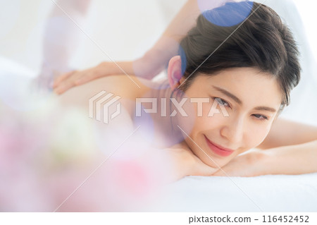 A middle-aged woman doing skin care at a beauty salon A middle-aged woman doing skin care at a beauty salon 116452452