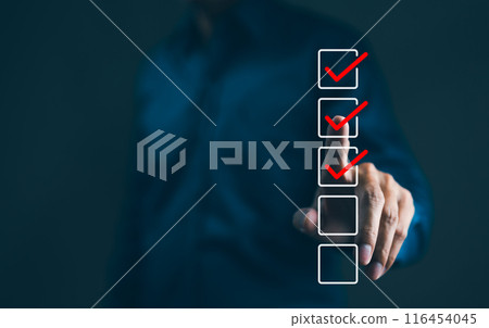 Businessman interacting with a virtual checklist with red check marks. A business professional is completing a checklist. tick correct sign mark in the checkbox, Checkmark, Filling out digital form, 116454045
