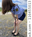 A female police officer who is out of breath and tired 116455013