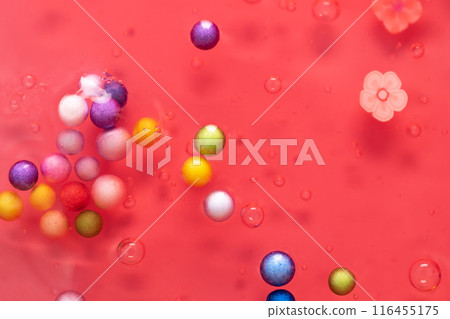 Colorful gel texture, clear skincare cream with bubbles and decorative figurines background, transparent beauty serum, colored cosmetic product close up Colorful gel texture, clear skincare cream with bubbles and decorative figurines background, transparent beauty serum, colored cosmetic product close up 116455175