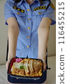 Female police officer presenting katsudon 116455215
