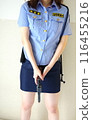 Female police officer with a pistol 116455216