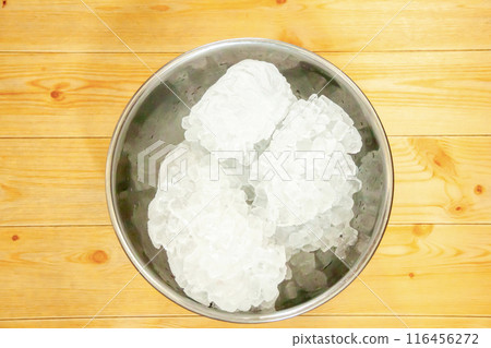 Crushed ice in a stainless steel bowl on a table Crushed ice in a stainless steel bowl on a table 116456272