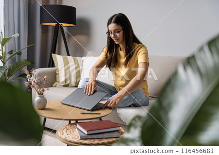 School hustle from home. This young lady is mastering the art of preparing for exams, one click at a time School hustle from home. This young lady is mastering the art of preparing for exams, one click at a time 116456681