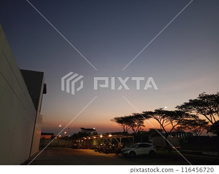 Sunset at the company's parking lot. 116456720