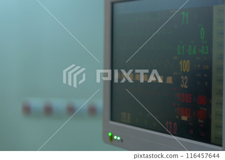 Close-up view of hospital monitor displaying vital signs in operating room Close-up view of hospital monitor displaying vital signs in operating room 116457644