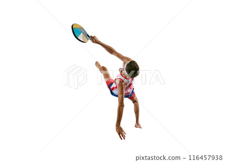 Sportive young man in sportswear, padel tennis player in motion, training, hitting ball with colorful racket isolated on white background 116457938