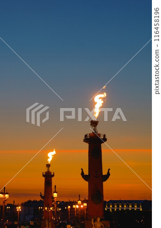 Fire lit torches on rostral columns at night in St. Petersburg, Russia, vertical Fire lit torches on rostral columns at night in St. Petersburg, Russia, vertical 116458196