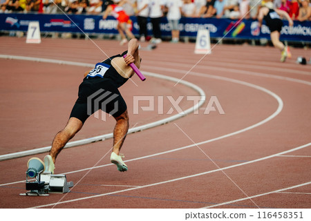 start running relay race for men in athletics competition 116458351