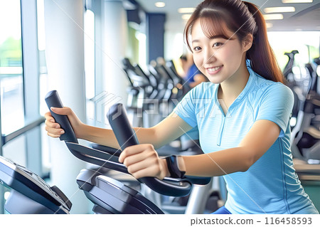 Image of a woman exercising at a fitness gym 116458593