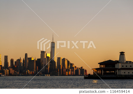 New York skyline as viewed across the Hudson River in New Jersey at sunset. New York skyline as viewed across the Hudson River in New Jersey at sunset. 116459414