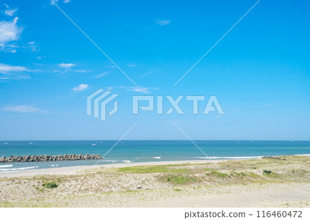A spectacular view from Nakatajima Sand Dunes in Hamamatsu City, Shizuoka Prefecture, overlooking a vibrant blue sky and the blue sea of Enshu-nada. A spectacular view from Nakatajima Sand Dunes in Hamamatsu City, Shizuoka Prefecture, overlooking a vibrant blue sky and the blue sea of Enshu-nada. 116460472
