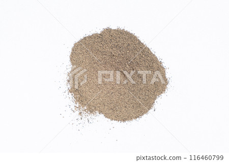 Spilled ground black pepper spicy seasoning on a white background Spilled ground black pepper spicy seasoning on a white background 116460799