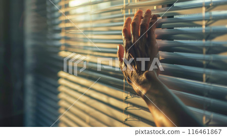 close up view of man's hand spreading blinds close up view of man's hand spreading blinds 116461867