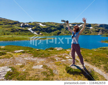 Tourist taking photo in norwegian nature 116462659