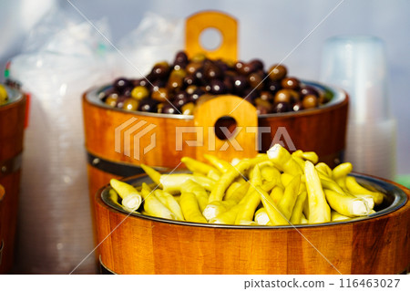 Olives and peppers for sale at market 116463027