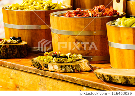 Olives and peppers for sale at market 116463029