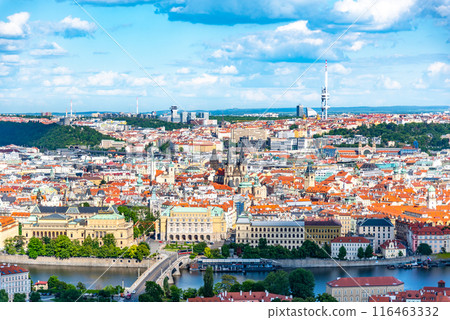 Overlooking the historic Prague Old Town, the Vltava River winds through, with distinct Zizkov Television Tower rising in the distance on a sunny day. Prague, Czechia 116463332
