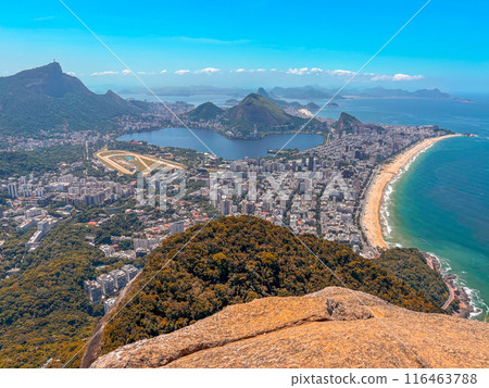 Two brothers hike Rio de Janeiro - man enjoying the view over Copacabana and Ipanema Two brothers hike Rio de Janeiro - man enjoying the view over Copacabana and Ipanema 116463788