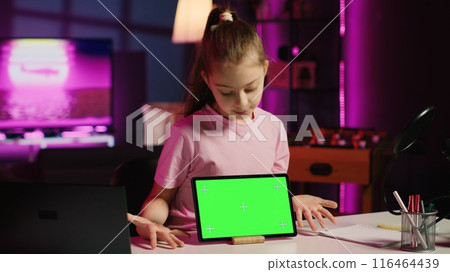 Cute child content creator filming technology review of newly released isolated screen tablet, unpacking it and presenting specifications to audience. Young online star showing mockup device to fans Cute child content creator filming technology review of newly released isolated screen tablet, unpacking it and presenting specifications to audience. Young online star showing mockup device to fans 116464439