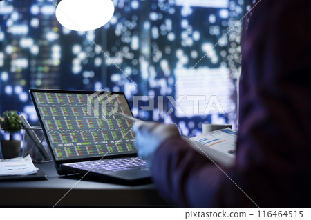 General manager looking at company file documents in office, working after hours to find ways to increase monthly income. Company advisor verifying legal accounting work on papers, metropolis view. General manager looking at company file documents in office, working after hours to find ways to increase monthly income. Company advisor verifying legal accounting work on papers, metropolis view. 116464515