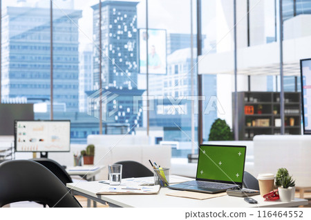 Empty insurance agency modern office with a green screen on laptop, space used for counseling meetings to help customers with retirement planning. Secure financial options. 116464552